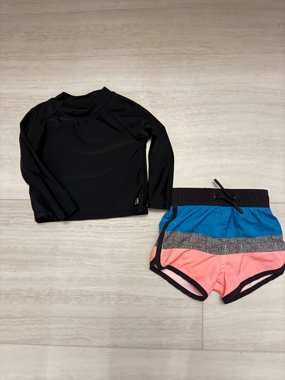 Little Bipsy swim trunks and rash guard